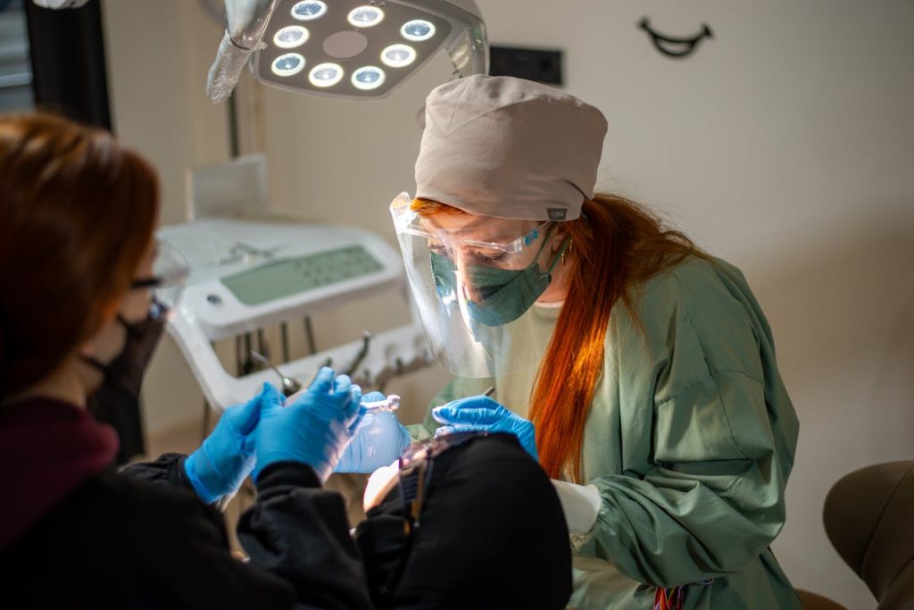 Dentist and patient in dental chair